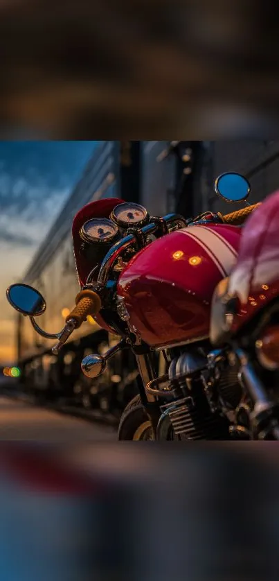 Vintage motorcycle with red body at sunset, reflecting a retro vibe.