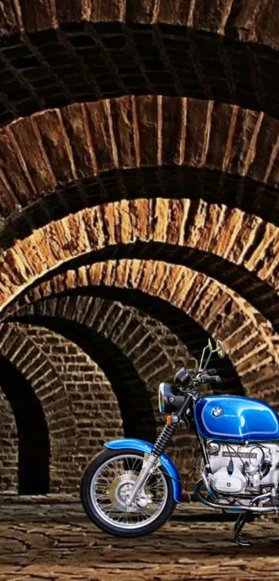 Vintage blue motorcycle under a stone archway with rustic tones.