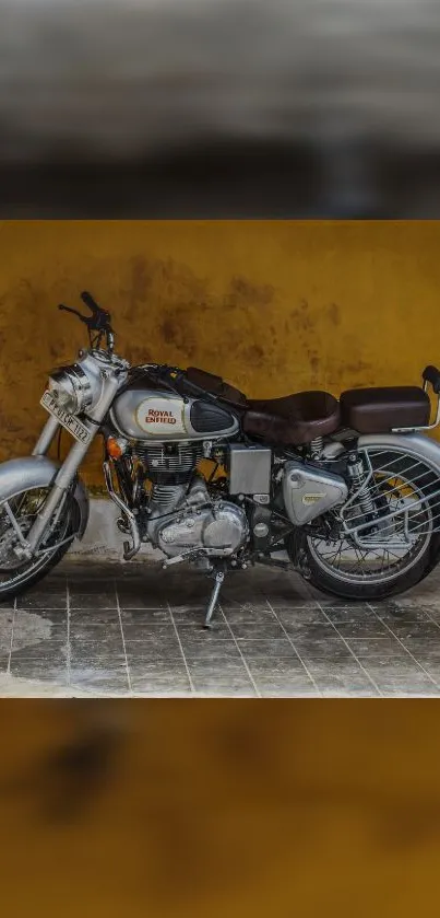 Classic motorcycle against a mustard yellow wall background.