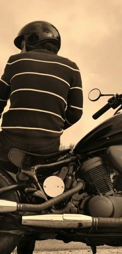 Sepia-toned wallpaper of a motorcycle rider facing away.