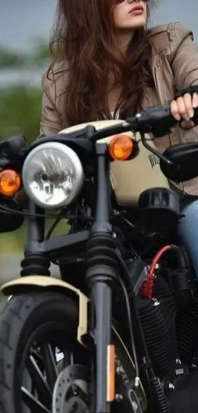 Biker in sunglasses rides vintage motorcycle on open road.