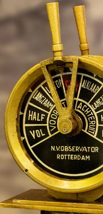 Vintage nautical instrument with brass finish and intricate detailing.