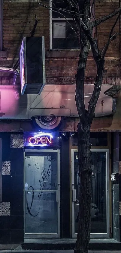 Moody urban facade with neon and vintage car at night.