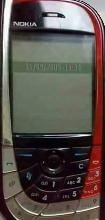 Vintage red Nokia mobile phone on display.