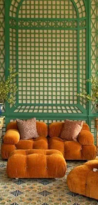 Vintage living room with orange sofas and green lattice walls.