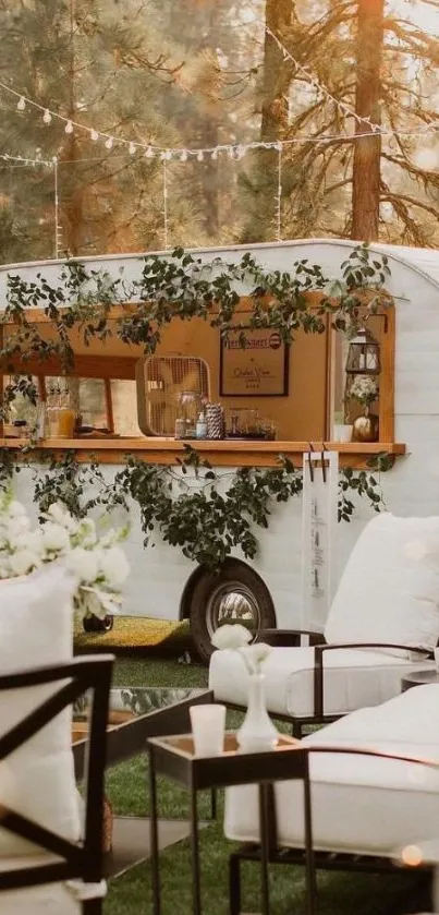 Vintage trailer in cozy outdoor garden setting with white chairs.