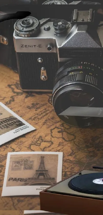 Vintage camera and pipe with postcards on a classic map.
