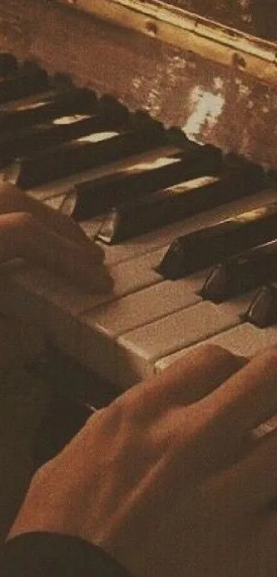 Hands playing an antique piano in warm sepia tones.