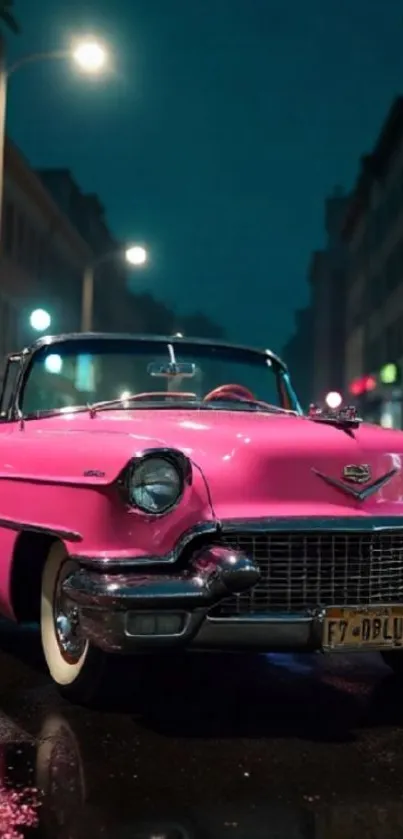 Vintage pink Cadillac parked under city streetlights at night.