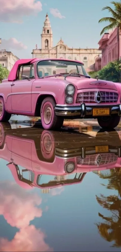 Vintage pink car reflecting in water with urban cityscape background.