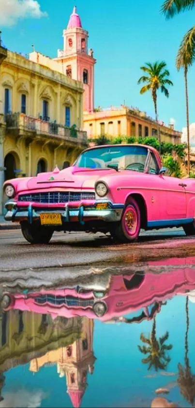 Vintage pink car with tropical cityscape in the background.