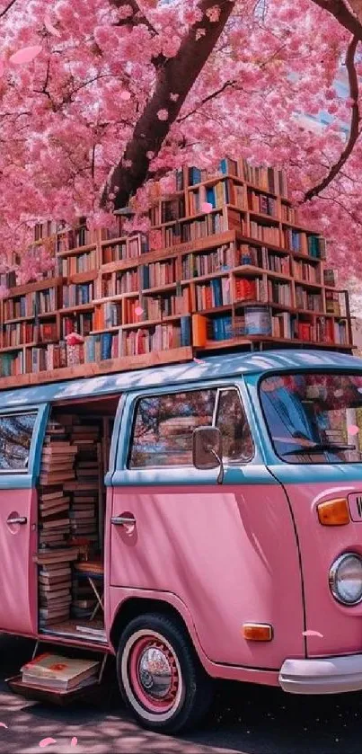 Pink vintage van with books under cherry blossom trees.