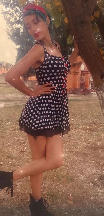 Woman in a vintage polka dot dress outdoors.