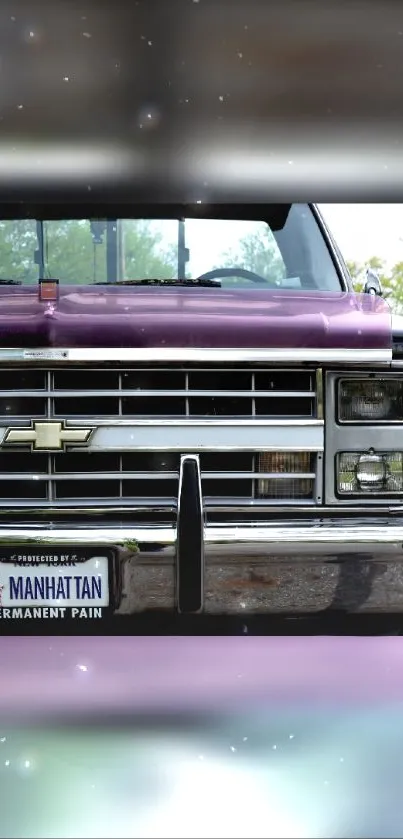 Front view of a purple vintage truck with license plate Manhattan.