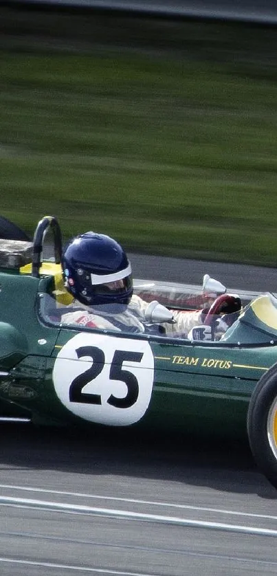 Vintage racing car speeding on track with green and yellow design.