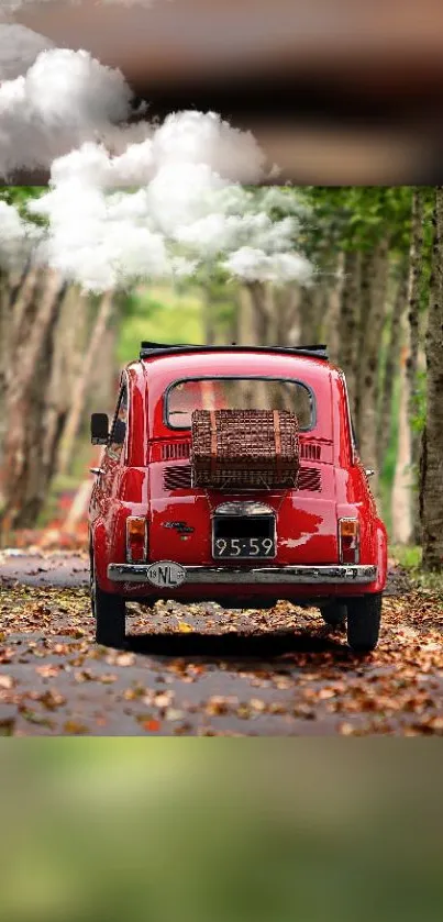 Vintage red car on forest road with clouds overhead.