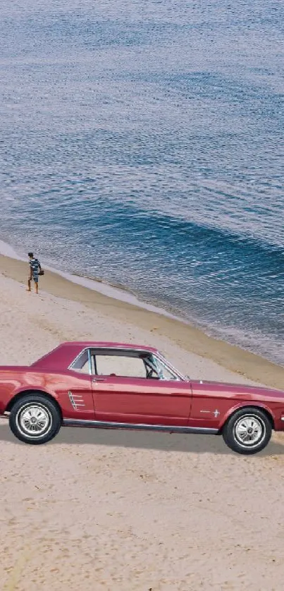 Vintage red car parked on a sandy beach with ocean waves in the background.