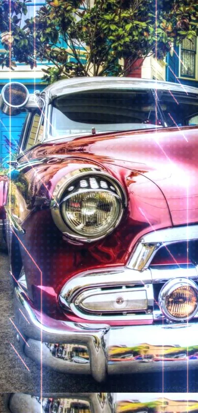 Vintage red car with glossy finish and chrome details parked on street.