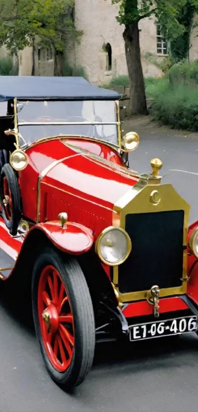 Vintage red car on a serene street.