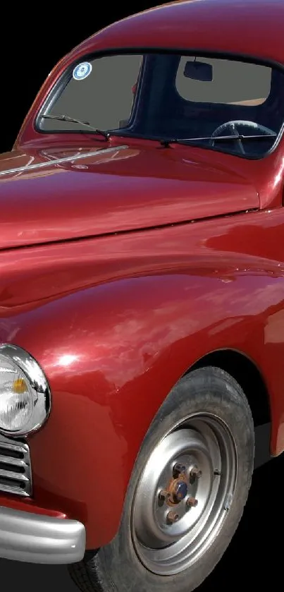 Vintage red classic truck with wooden cargo bed on display.