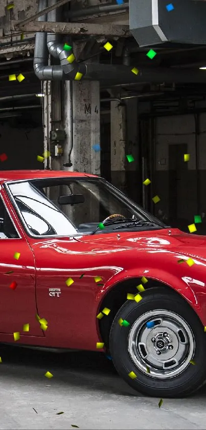 Vintage red sports car in an industrial setting.