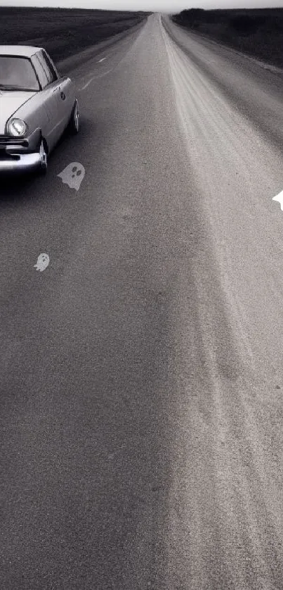 Vintage car on an empty road, gray-toned wallpaper.