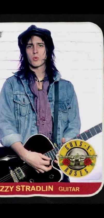 Guitarist in denim jacket with guitar and band logo.