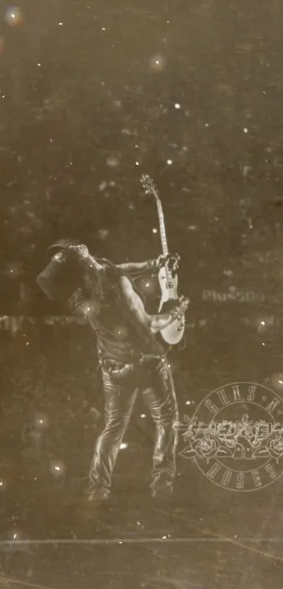 Sepia vintage wallpaper featuring rock guitarist on stage.