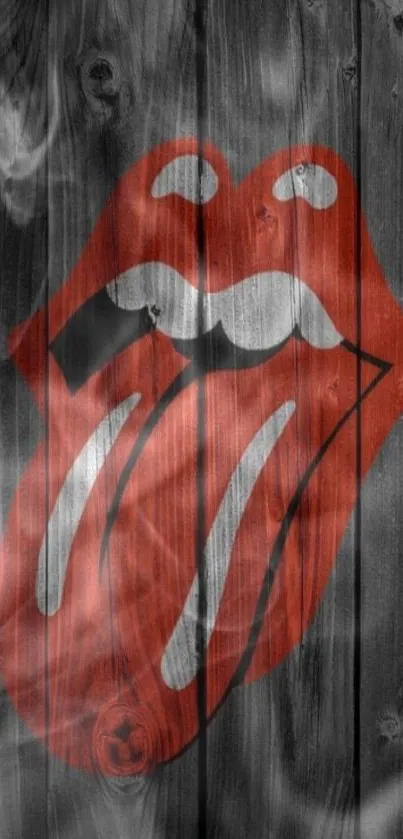 Rock icon lips logo on dark wooden background wallpaper.