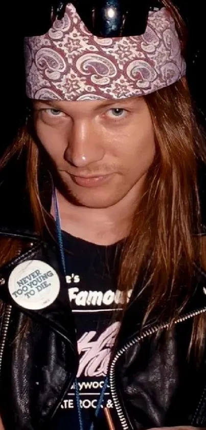 Rock star wearing bandana and leather jacket in retro style.