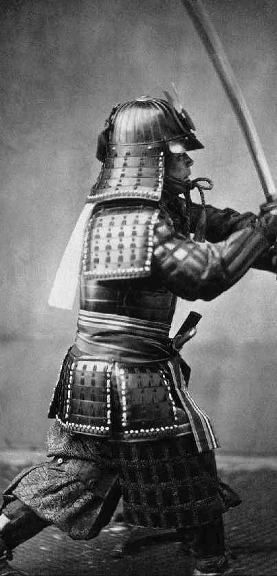 Samurai warrior in traditional armor holding a katana in grayscale.