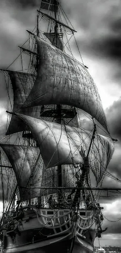 Black and white vintage ship with dramatic clouds.