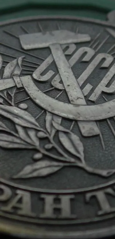 Close-up of Soviet emblem with metallic textures and historical symbols.