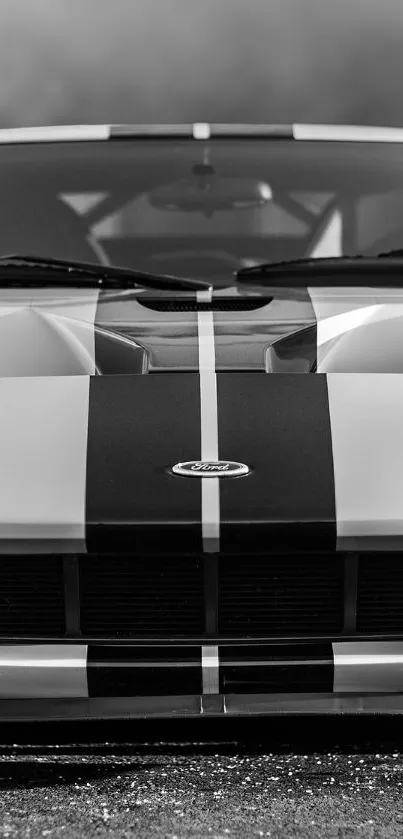 Front view of a vintage sports car in black and white.