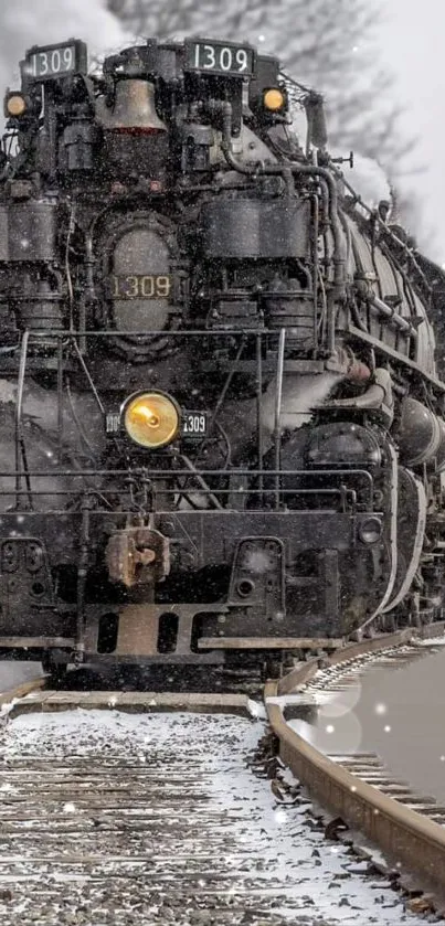 Vintage steam train on snowy railroad tracks.