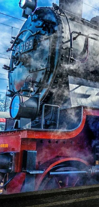 Vintage steam train emits mist in a blue sky setting.