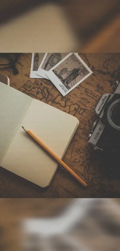 Vintage camera, map, and notebook mobile wallpaper.