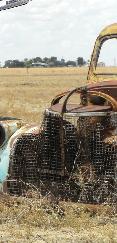 Rusted vintage truck in desert scenery with airplane overhead.