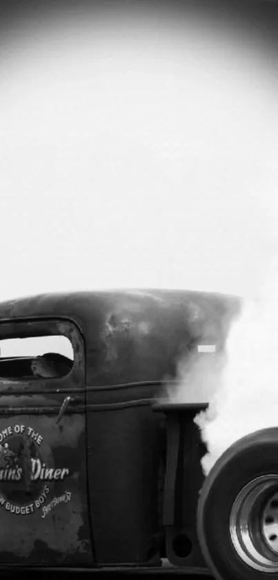 Black and white vintage truck with smoke art wallpaper.