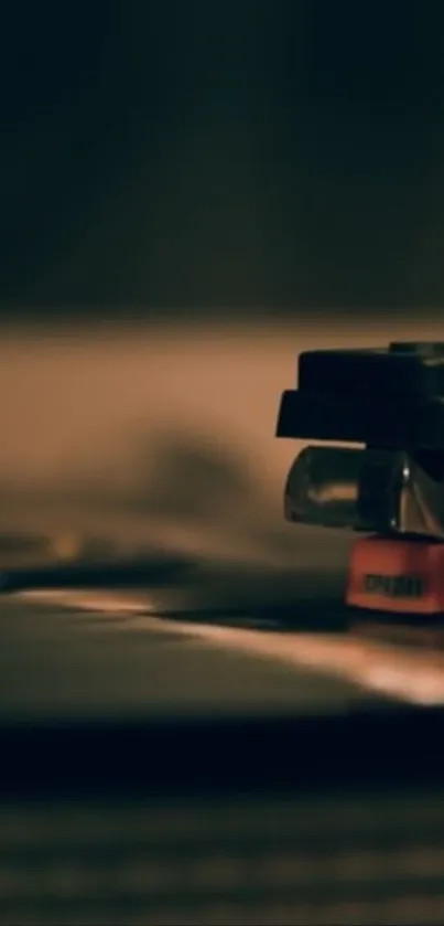 Close-up of a stylus needle on a vinyl record player.