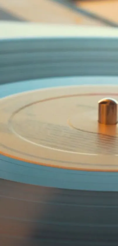 Vintage turntable with vinyl record, offering a soft aesthetic in light blue tones.