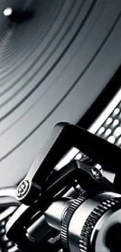 Close-up of a vintage turntable in black and white.