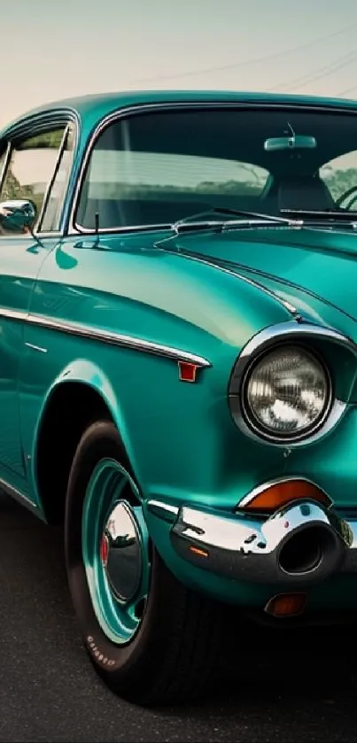 Vintage turquoise car parked on a road under clear skies.