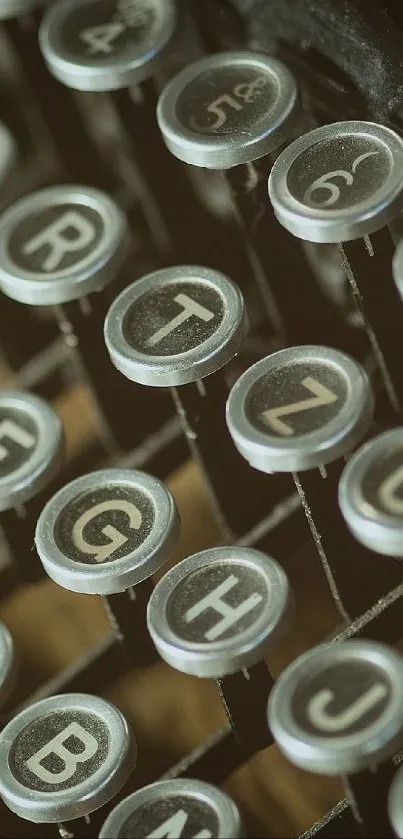 Close-up of vintage typewriter keys on a dark brown background.