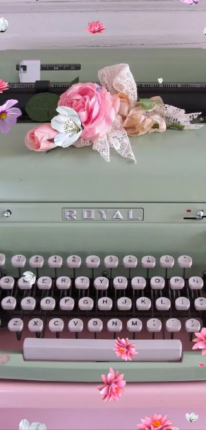 Vintage typewriter with flowers on pink background.