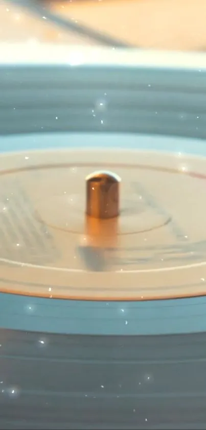 Golden spinning vinyl record on turntable with dreamy glow.