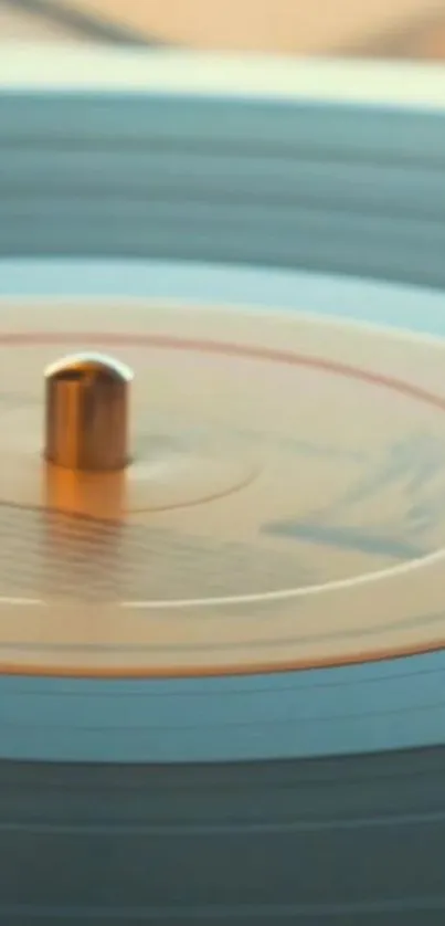 Vintage vinyl record spinning on a player, blue-gray aesthetic.