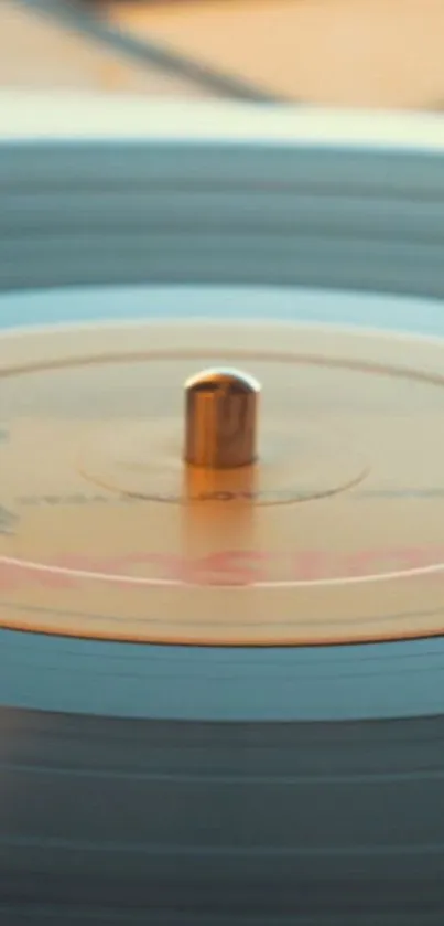 A spinning vinyl record with a beige label on a turntable.