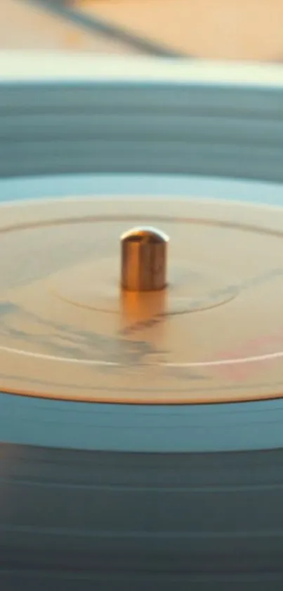 Close-up of a spinning vintage vinyl record with a golden brown tone.