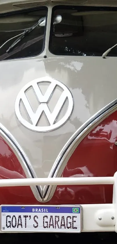 Close-up of a vintage Volkswagen bus in vibrant red and cream.